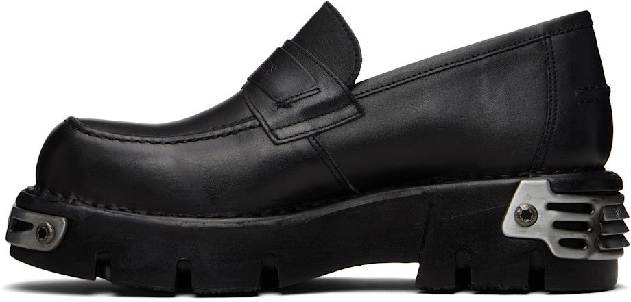VETEMENTS
Flâneurs noirs à ferrures en métal édition New Rock