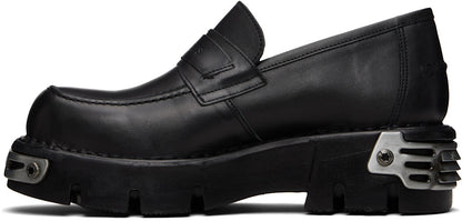 VETEMENTS
Flâneurs noirs à ferrures en métal édition New Rock